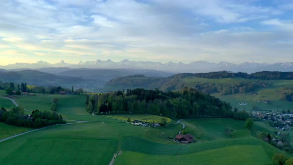 Timelapse over Bolligen near Bern the capital of Switzerland with the Alps in the background alt
