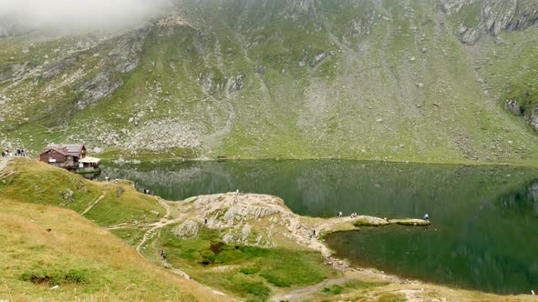 Glacial Balea Lake Under Clouds And On Top Of Fagaras Mountain 4K Video
