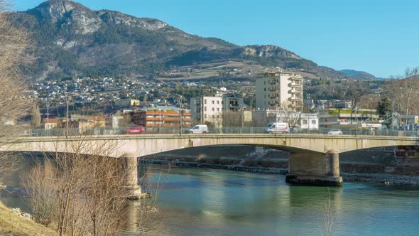 Bridge with Heavy Traffic Connects Parts of Old Town Trento alt