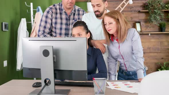 Middle Age CEO Sharing Some Valuable Advices to Her Young Team alt