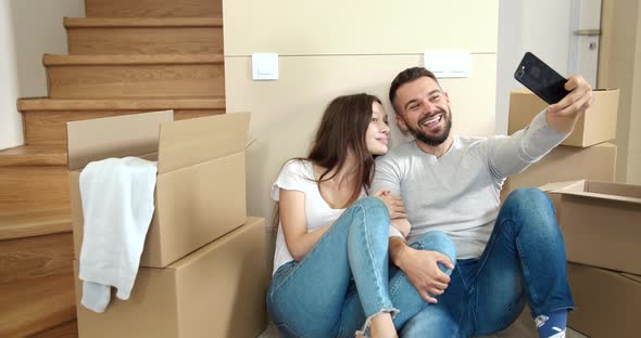 Couple Making Selfie in New Home