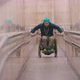 Disabled Man in Wheelchair Getting Up on the Long Special Ramp Leaning on the Railing - VideoHive Item for Sale
