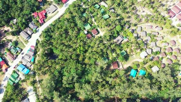 Wide overhead copy space shot of a white paradise beach and aqua turquoise water background in 4K alt