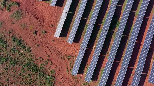 Aerial View of Giant Fields with Solar Photovoltaic Batteries to Create Clean Ecological Electricity
