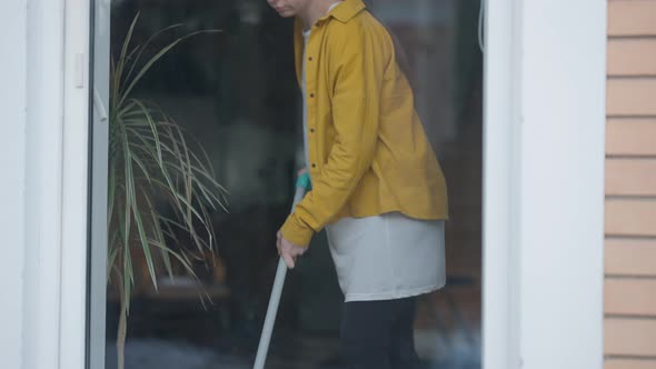 Young Pregnant Woman Vacuuming Floor at Home Having Back Ache Sighing alt