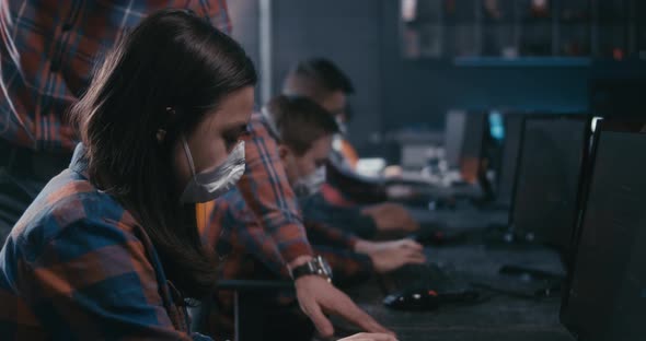 Student and Teacher Discussing Programming in School alt