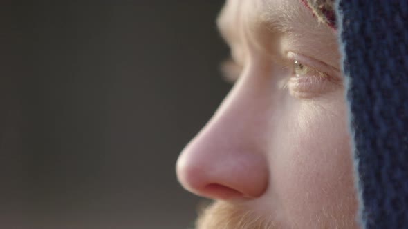 ECU of a handsome bearded ice bather doing conscious breathing before taking the plunge alt