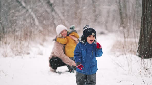 Amazing View How Toddler Boy Running To Camera with Smile in Winter Forest alt