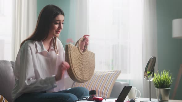 Woman Is Showing Bag To Friend Online