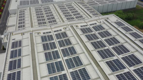 Solar power station on factory rooftop alt