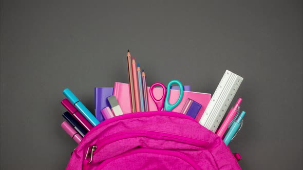  Partly view backpack with sticking out school supplies. Stop motion alt