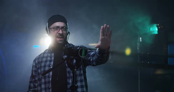 Young Director Giving Instructions on a Film Set alt