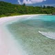 Aerial View of Tropical Paradise Beach with White Sand Turquoise Waters at Anse Coco. Blue Lagoon - VideoHive Item for Sale