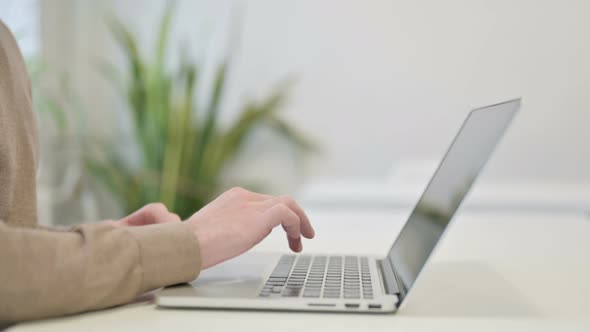 Close Up of Man Using Laptop for Work alt