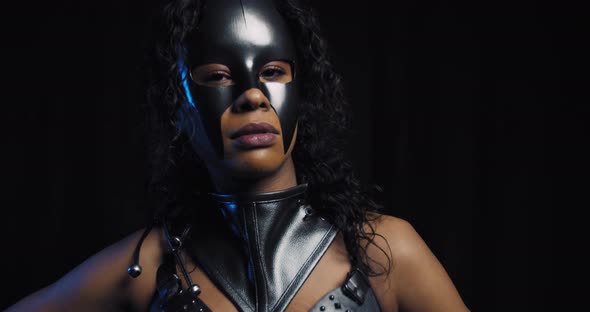 Beautiful Young Woman in Black Mask and Leather Clothes Catwoman Cosplay alt