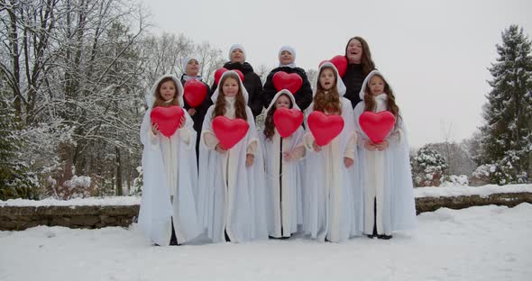 Young Children Together With The Tutor Sing A Song And Release Inflatable Balloons