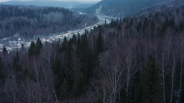 Aerial View of the Cold River Rocks and Forest in Early Winter alt