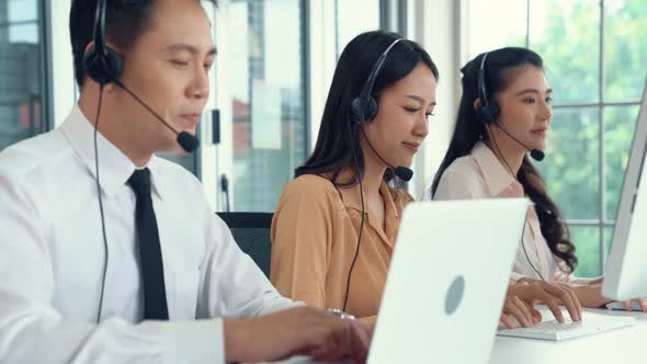 Business People Wearing Headset Working Actively in Office alt