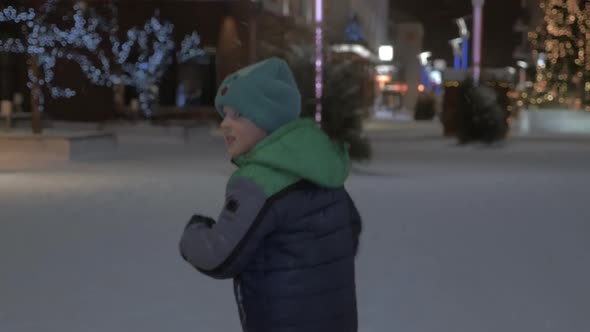 Boy running outdoor during Christmas holidays alt