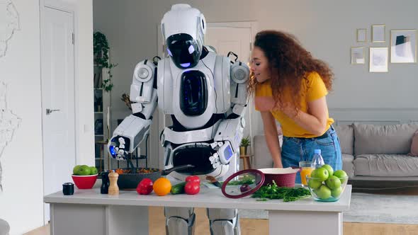 Woman Is Smelling Food Cooked By the Robot alt