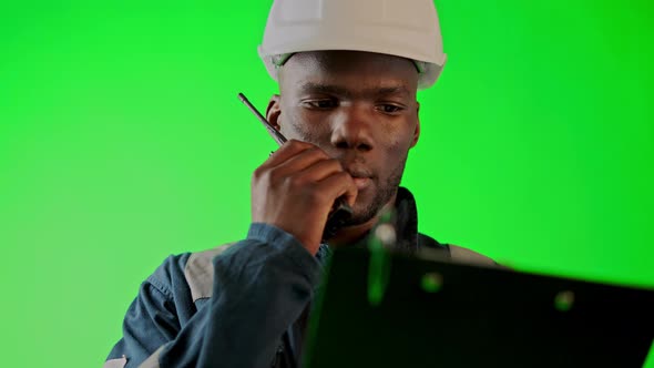 Black Seafarer Discussing Reports with Colleagues Via Radio alt