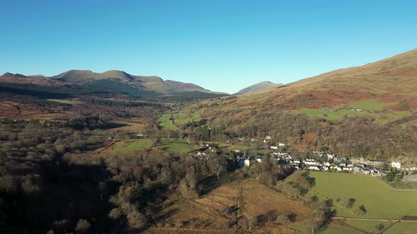 Aerial view of green and brown countryside in Wales