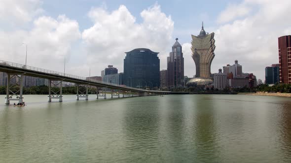 Macau Day Cityscape Nam Van Lake Timelapse Pan Up alt