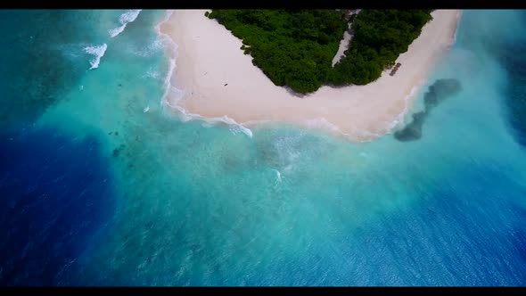 Aerial drone view seascape of idyllic coastline beach trip by clear ocean with white sand background alt