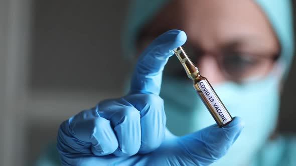 Doctor holding a recipient with the coronavirus COVID-19 vaccine