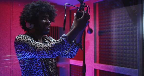 African american singer recording new music album inside boutique studio alt