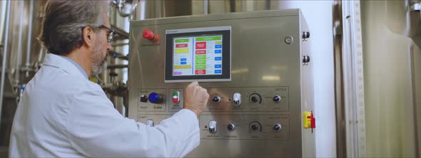 Engineer typing on a monitor alt