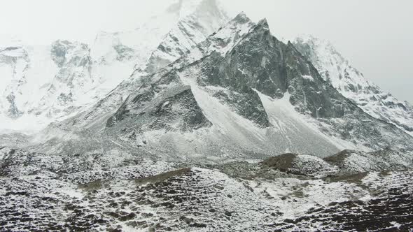 Ama Dablam Mountain on Cloudy Day. Himalaya, Nepal. Aerial View alt