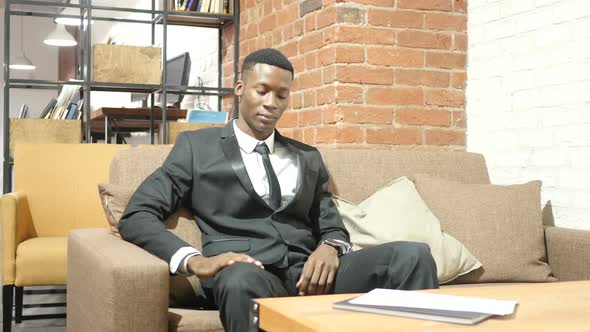 Black Businessman Tired, Sleeping at Work alt