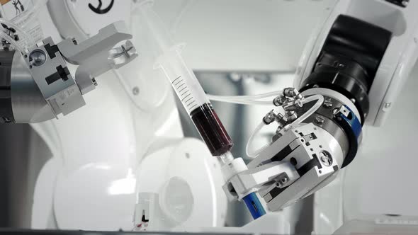 The Innovative Arms of a Robotic Arm Make an Injection of Chemotherapy for a Cancer Patient alt