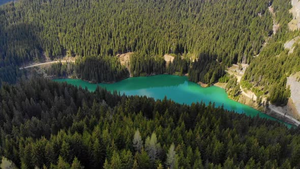 Mountain lake with turquoise water and green trees. Mountains, forest and lake. alt