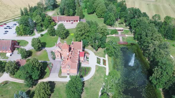 Jaunmoku Brick Medieval Castle Near Tukums, Latvia  Aerial Dron 4k Shot Jaunmokas Manor Park. alt