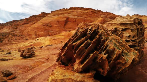Panning view past some rocks in The Bone Yard near the Wave. alt