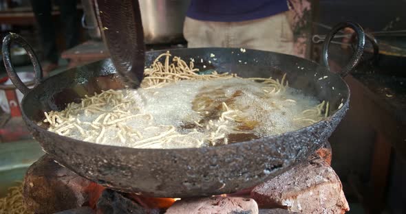 Indian Street Food Murukku Cooking in Rajasthan. Deep Fried Tasty Vegetarian Crispy Snack in Oil alt