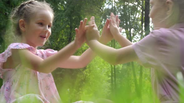 Two Little Girls Playing in the Park