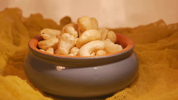 Cashew Nuts Are Rotated in a Clay Pot