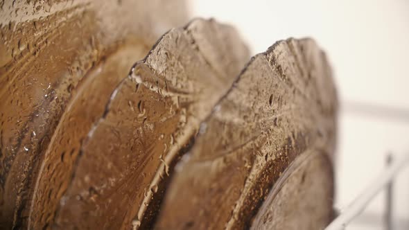 Cleaning Plates Under Water Droplets Inside Dishwasher Machine alt