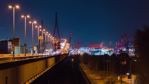 Time lapse of Koehlbrand bridge with cars and trucks, Eurokai and Burchardkai Terminal in distance alt
