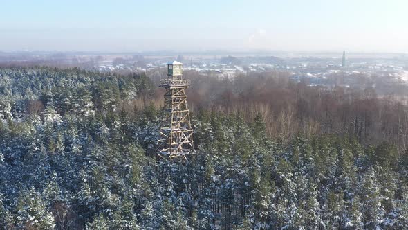 Aerial view of Forest rangers tower in a snowy forest