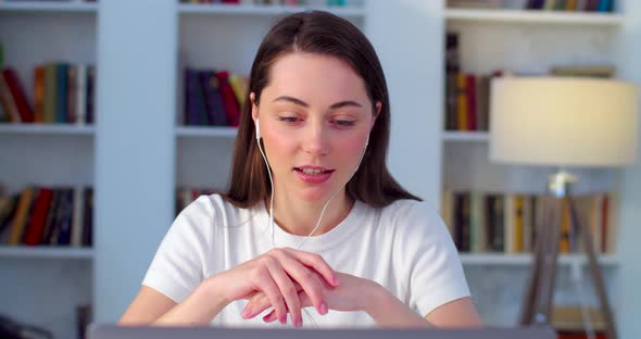 Front View of Woman Wearing Headset While Making Online Video Conference Call Slow Motion