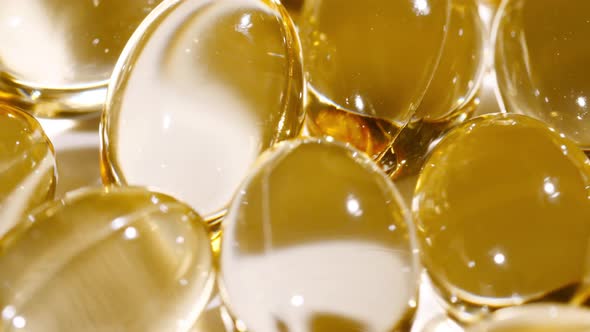 Macro Shot of a Yellow Oil Capsules Vitamin C Omega 3 Rotating Closeup alt