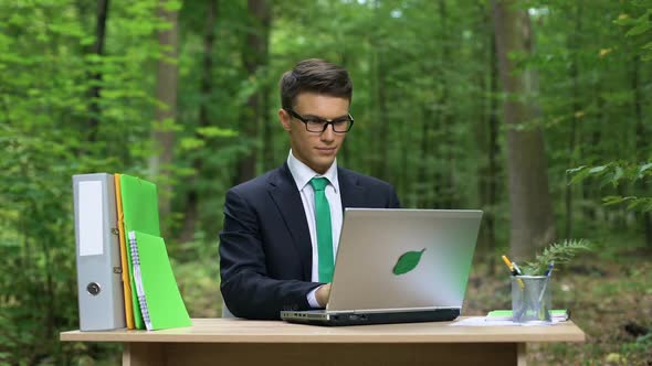 Successful Businessman Relaxing Outdoors After Hardworking, Eco-Friendly Office alt