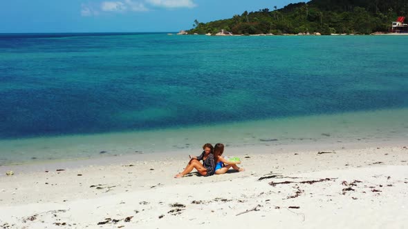 Female models posing on exotic island beach holiday by blue sea with white sand background of Koh Ph
