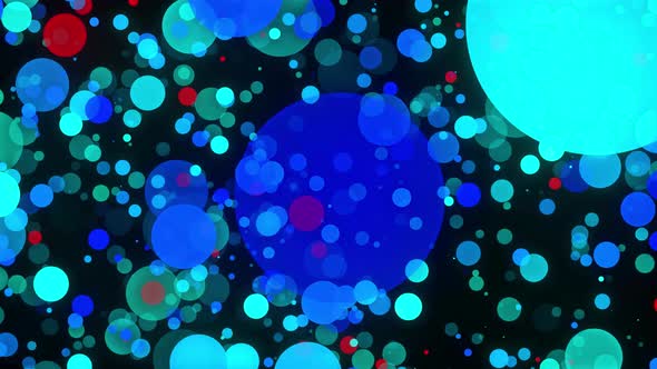 Multicolored confetti or glitter particles glitter in the light with depth of field. alt