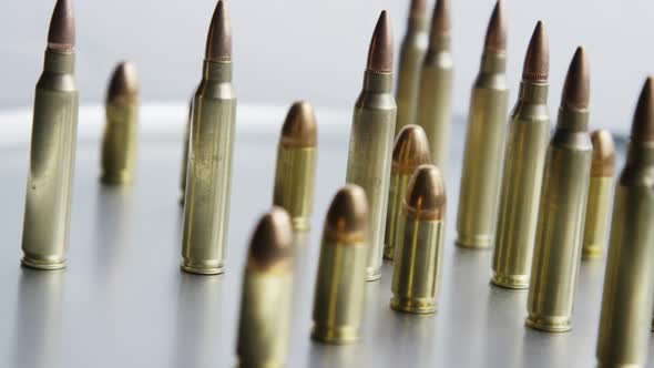 Cinematic rotating shot of bullets on a metallic surface - BULLETS 077 ...