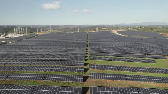 Vast solar plant in Lagos, Portugal - green energy solution; aerial pullback